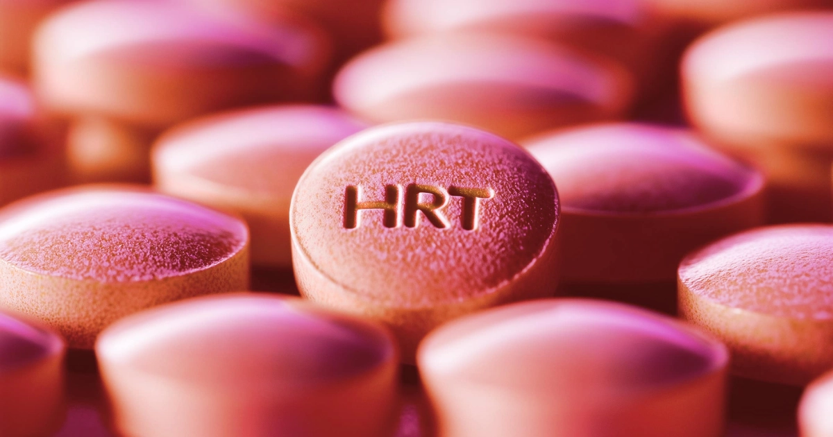 Close-up of pink hormone replacement therapy HRT tablets with the letters HRT engraved on one pill in Brooklyn NY